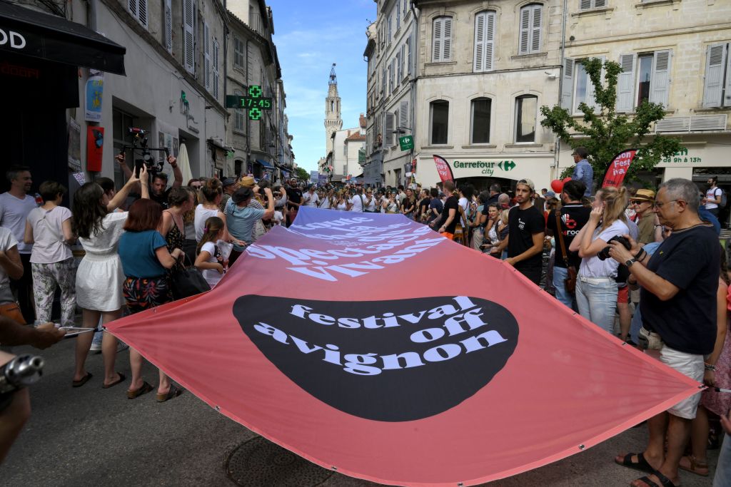Actors and musicians take part in the parade of the Off Theatre Festival in Avignon, southern France, on July 6, 2022. (Photo by Nicolas TUCAT / AFP) (Photo by NICOLAS TUCAT/AFP via Getty Images)